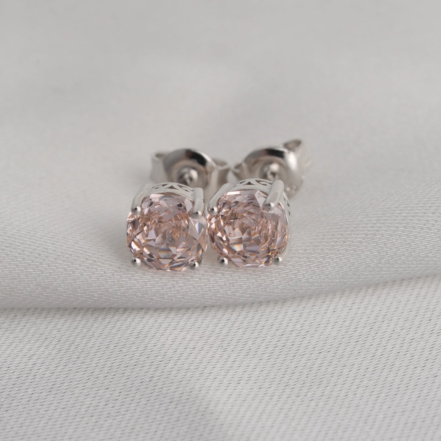 Delicate 1.5ct rose-cut octagon morganite pink stud earrings in white gold-plated sterling silver, sparkling with lab-created zircon accents.