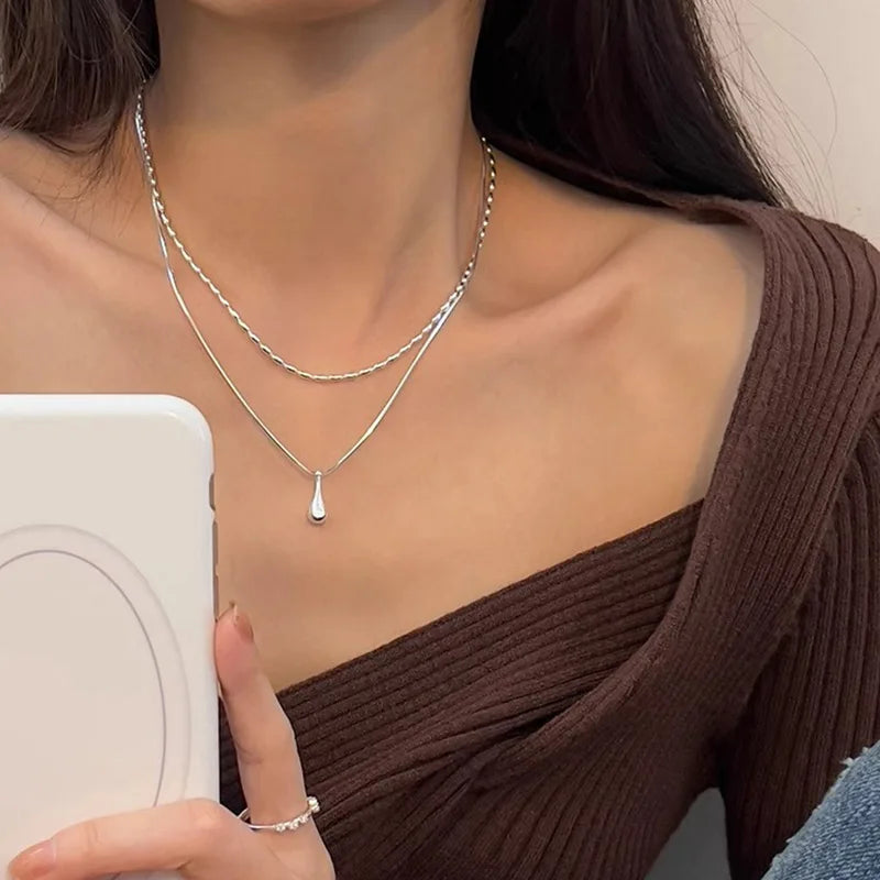Elegant 925 sterling silver double-layer necklace with a delicate, handmade pendant, perfect for everyday or special moments.