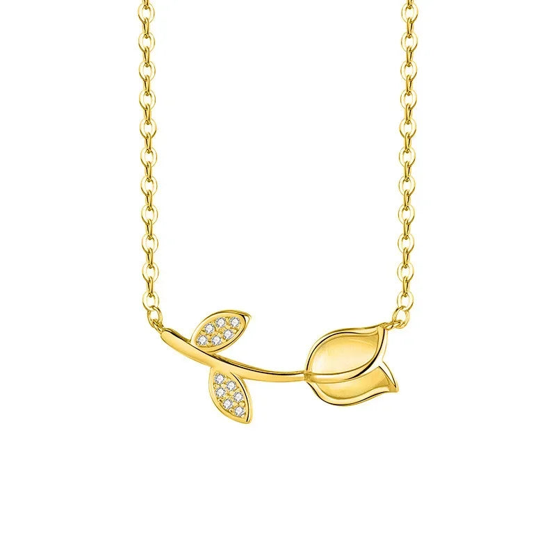 Delicate 925 sterling silver necklace with a tiny botanical pendant featuring a plant motif and sparkling zircon accent.