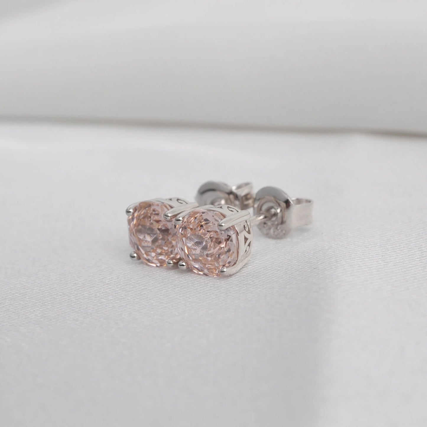 Delicate 1.5ct rose-cut octagon morganite pink stud earrings in white gold-plated sterling silver with sparkling zircon accents.