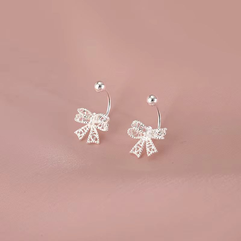 Delicate 925 sterling silver bowknot stud earrings with a charming, romantic design, perfect for any special occasion.