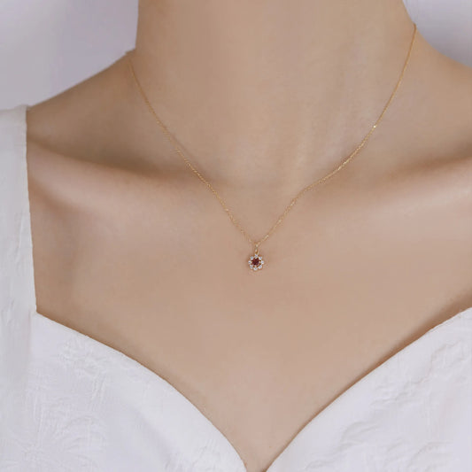 Delicate 925 sterling silver necklace with a radiant sun pendant featuring a sparkling zircon center and gold-plated accents.