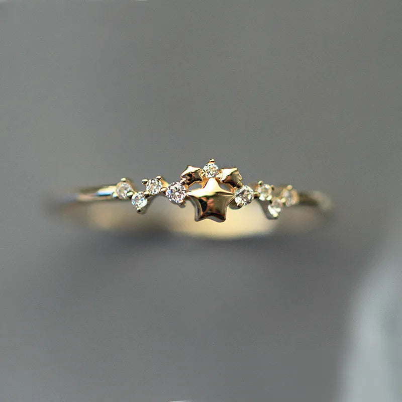 Delicate 925 sterling silver ring plated in 14K gold, featuring a sparkling zircon star design for a trendy, elegant look.