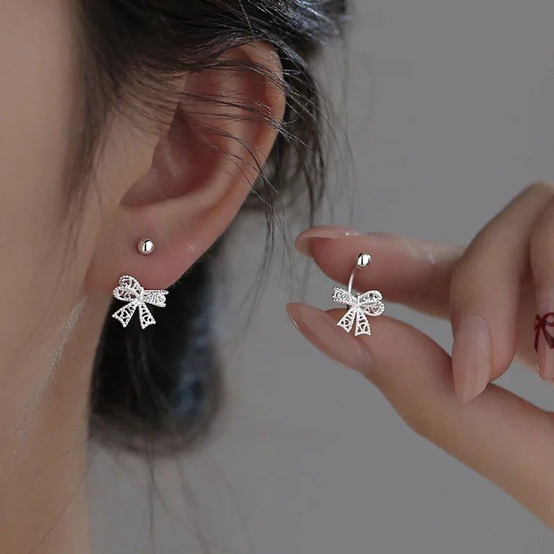 Charming 925 sterling silver bowknot stud earrings with a delicate, cute design, perfect for romantic occasions.