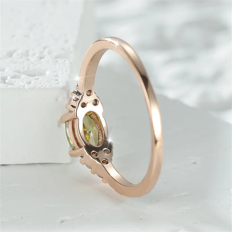 Stunning oval cubic zirconia ring with a prong-set, sparkling stone on a sleek, modern band, perfect for any occasion.