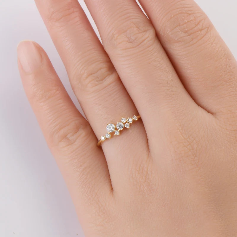 Elegant 14K gold-plated moissanite ring with a sparkling round brilliant stone in a secure prong setting, perfect for special occasions.