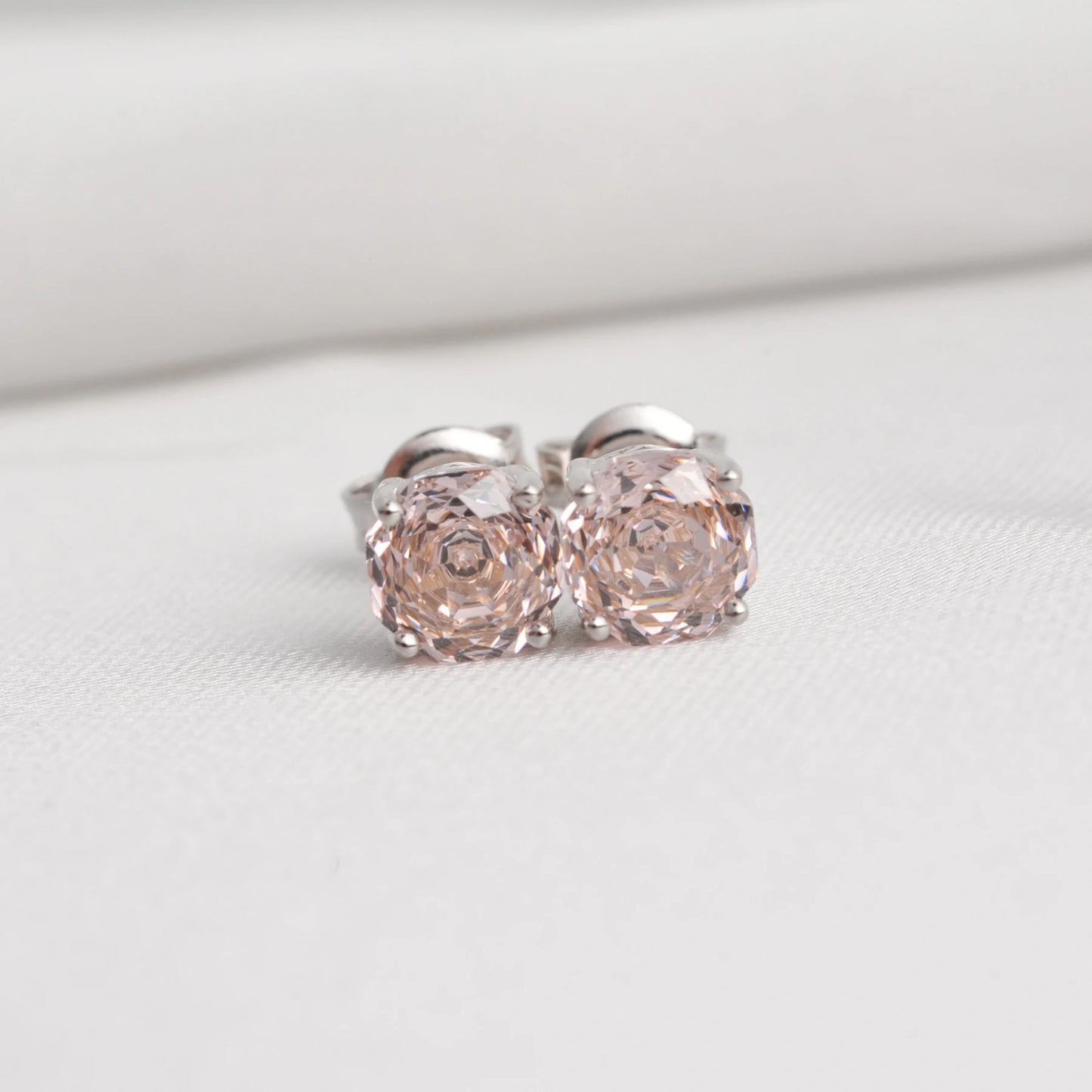 Delicate 1.5ct rose-cut octagon morganite pink stud earrings in white gold-plated sterling silver, sparkling with lab-created zircon accents.