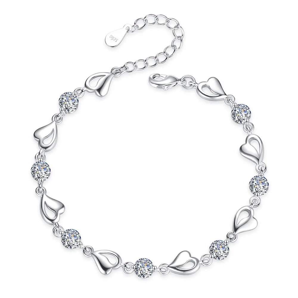 Delicate 925 sterling silver bracelet featuring a heart-shaped design with sparkling zircon crystals for a whimsical touch.