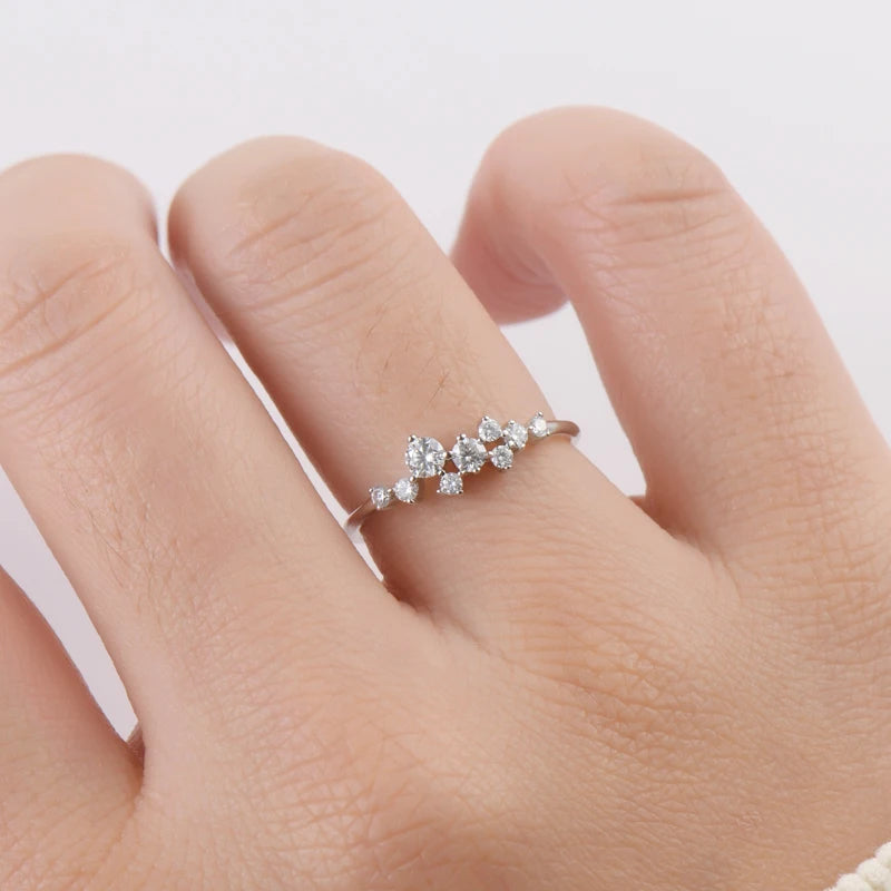 Elegant 14K gold-plated moissanite ring with a sparkling round brilliant center stone in a secure prong setting.