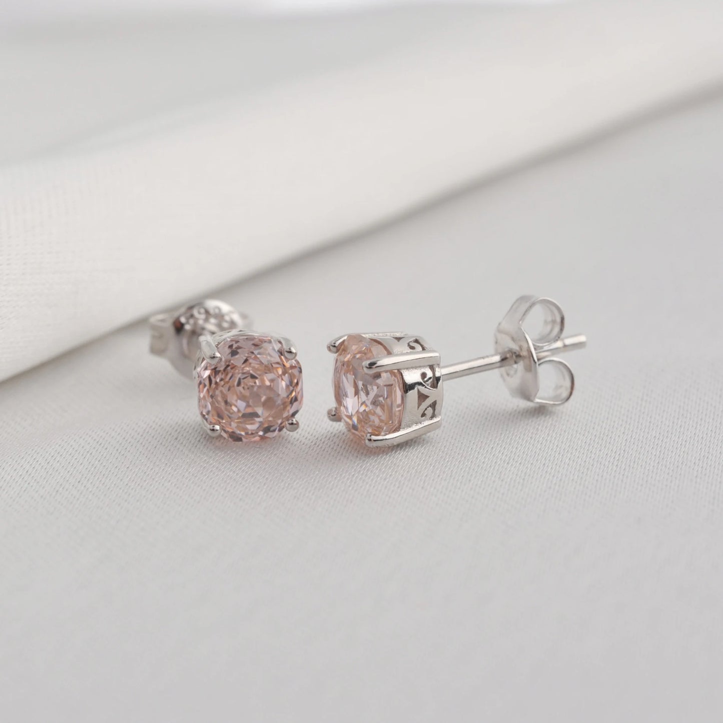 Delicate 1.5ct rose-cut octagon morganite pink stud earrings in white gold-plated sterling silver, sparkling with lab-created zircon accents.