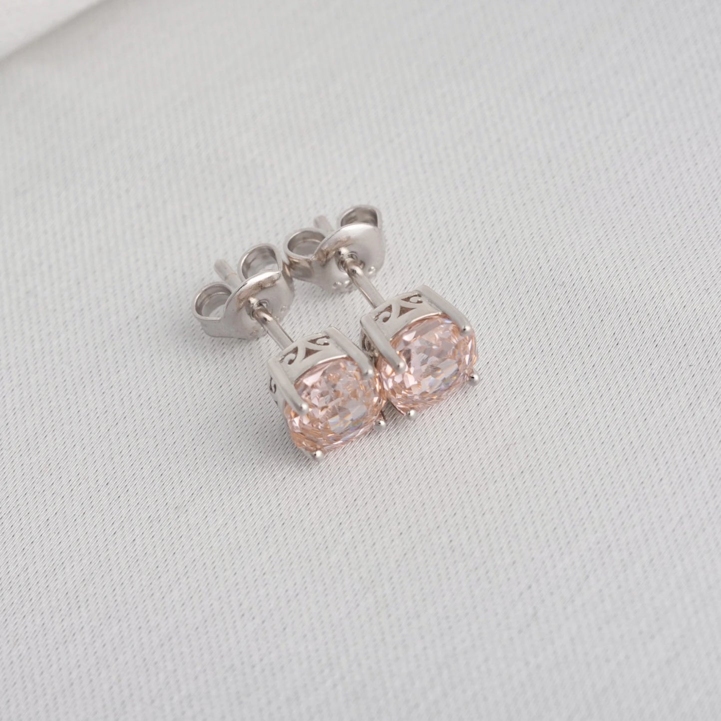 Delicate 1.5ct rose-cut octagon morganite pink stud earrings in white gold-plated sterling silver, sparkling with lab-created zircon accents.