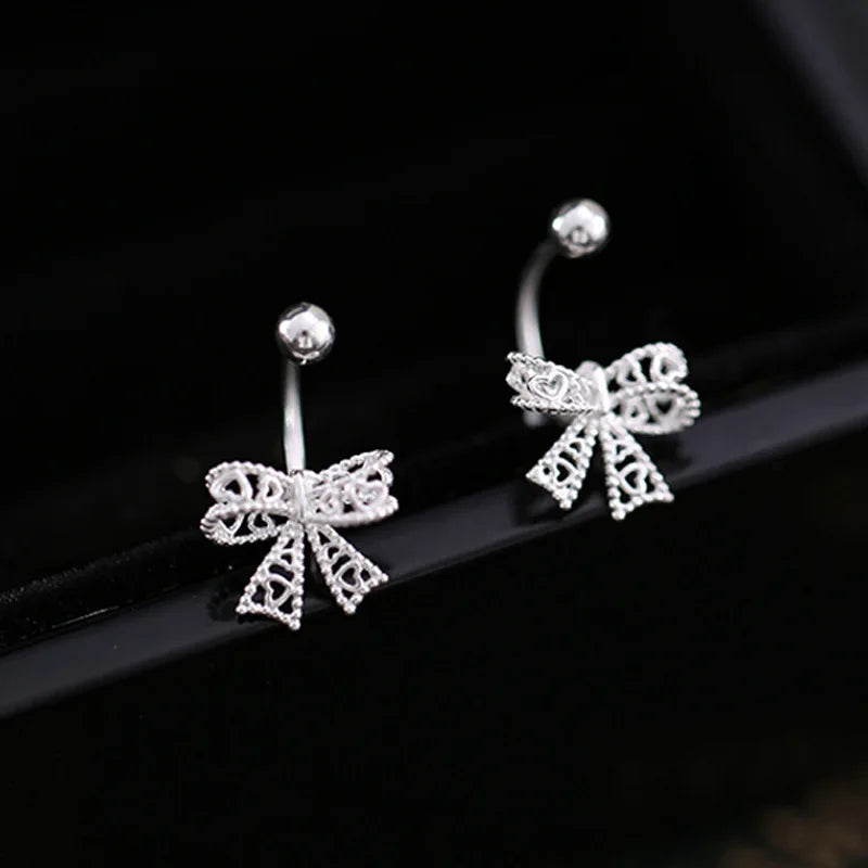 Charming 925 sterling silver bowknot stud earrings with a delicate, romantic design, perfect for any special occasion.