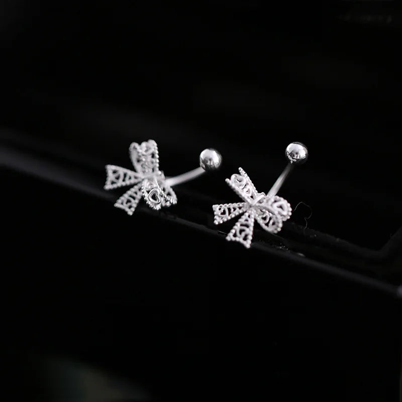 Delicate 925 sterling silver bowknot stud earrings with a cute, romantic design, perfect for any special occasion.