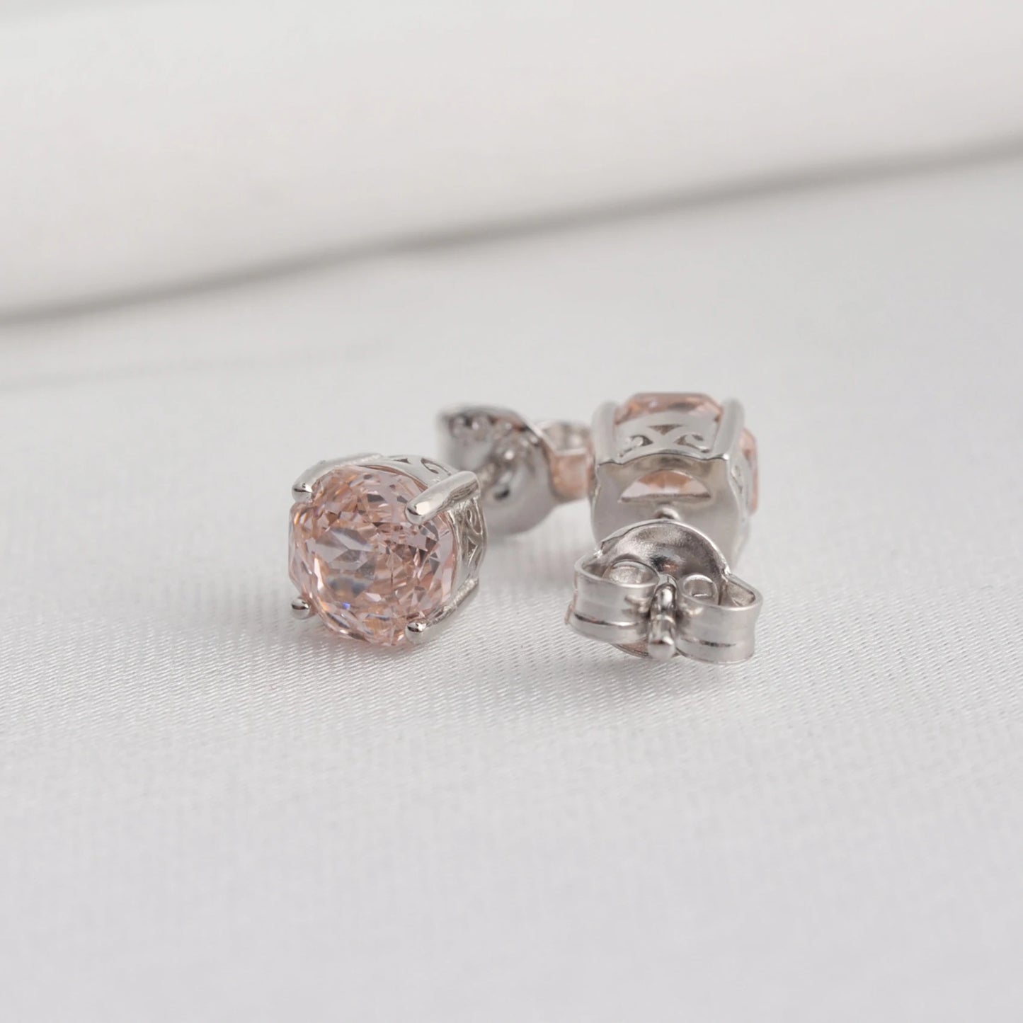 Delicate 1.5ct rose-cut octagon morganite pink stud earrings in white gold-plated sterling silver, sparkling with lab-created zircon accents.