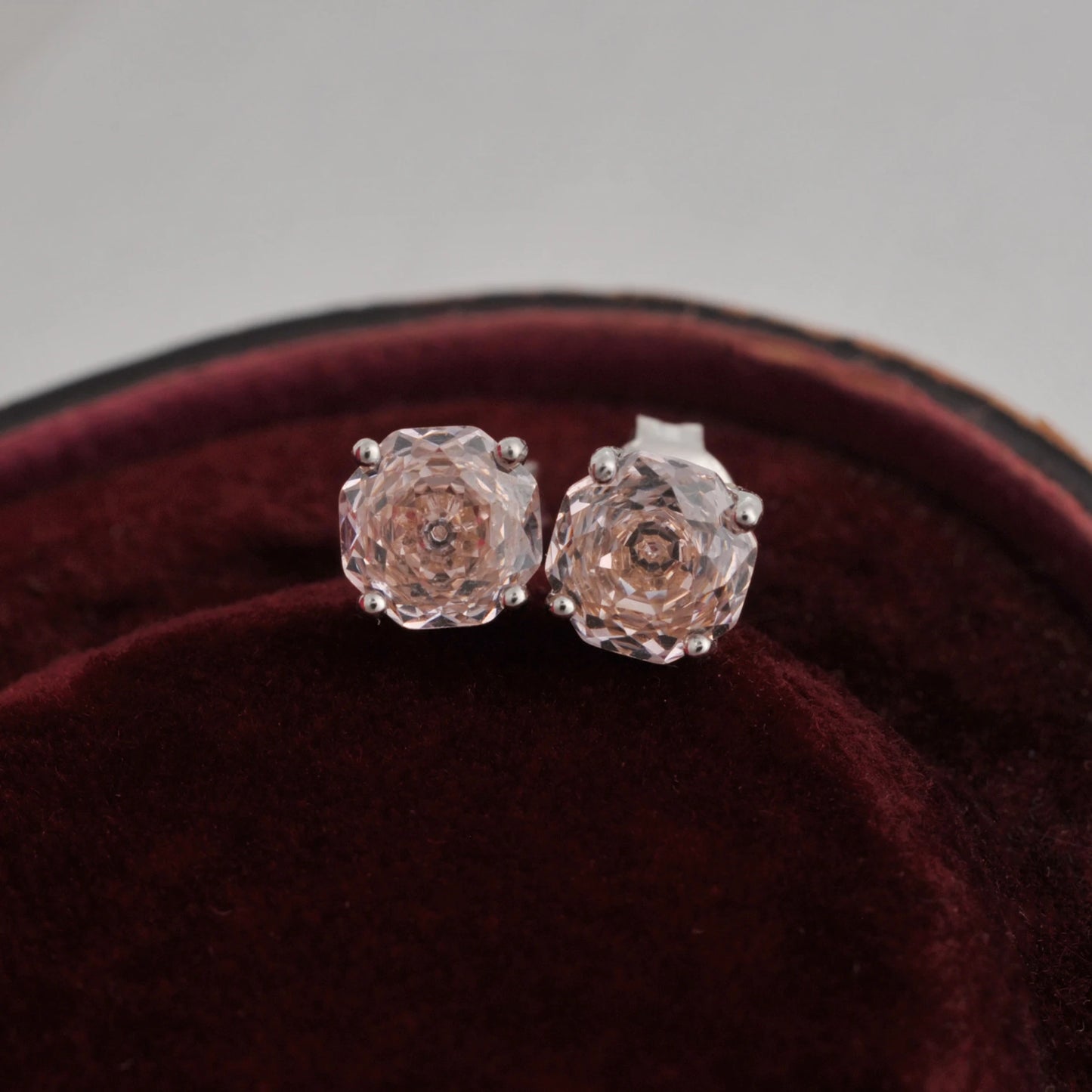 Delicate 1.5ct rose-cut octagon morganite pink stud earrings in white gold-plated sterling silver, sparkling with lab-created zircon accents.
