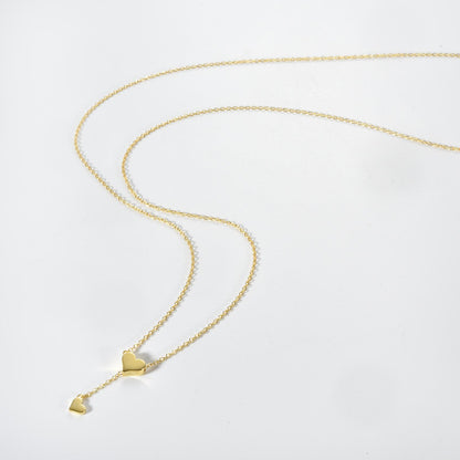 Delicate silver heart pendant necklace with a shimmering zircon center on a sleek 65cm snake chain, perfect for office elegance.