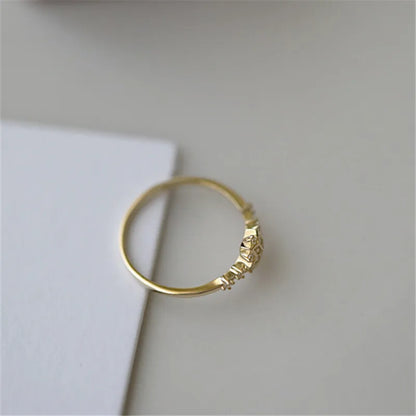 Delicate 925 sterling silver ring with 14k gold plating, featuring a romantic snowflake design and sparkling zircon center.