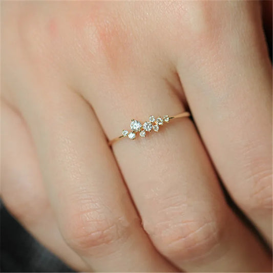 Elegant geometric zircon ring in gold-plated sterling silver, showcasing a precision-cut stone in a modern bezel setting.