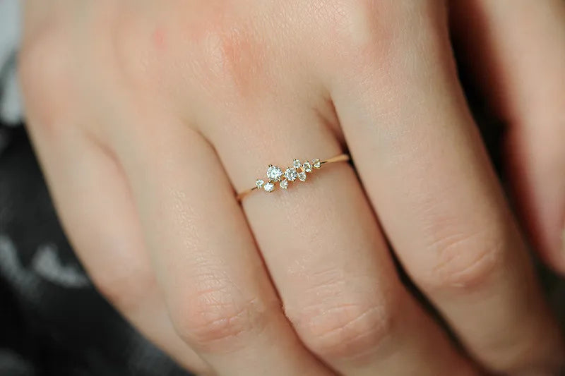 Elegant geometric zircon ring in gold-plated sterling silver, featuring a sparkling, precision-cut stone in a trendy design.