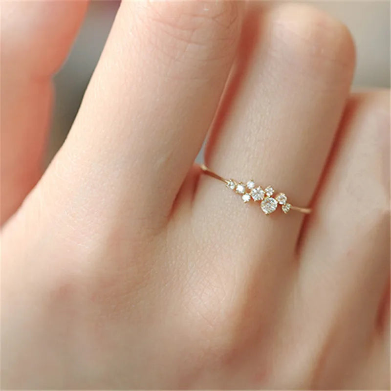 Elegant geometric zircon ring in gold-plated sterling silver, showcasing a precision-cut stone in a trendy bezel setting.