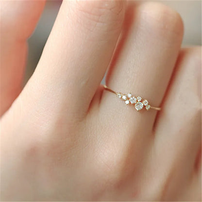 Elegant geometric zircon ring in gold-plated sterling silver, showcasing a precision-cut stone in a trendy bezel setting.