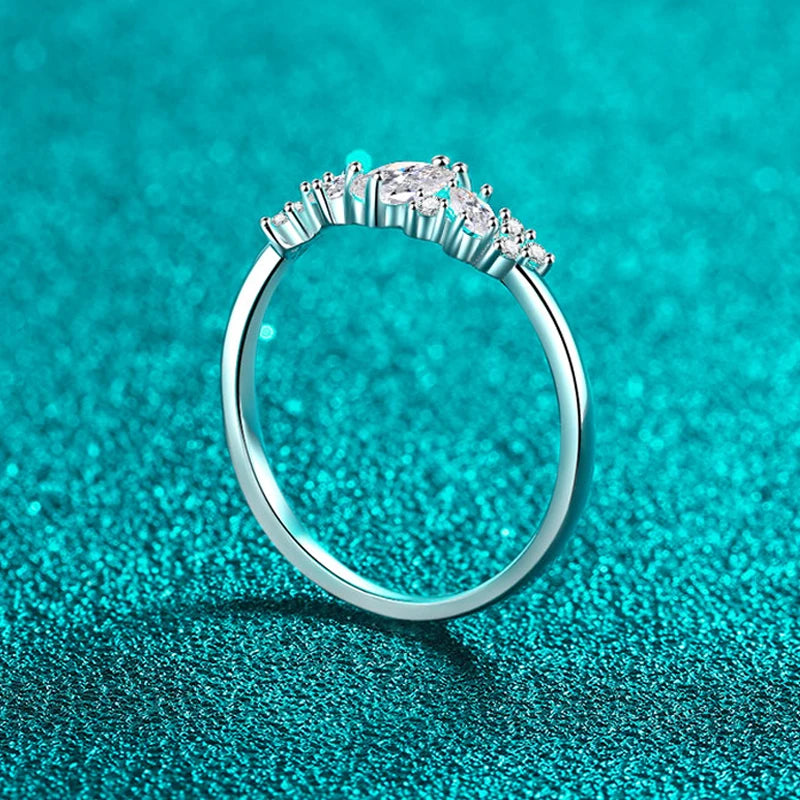 Stunning marquise-cut moissanite solitaire ring in sterling silver, featuring a sparkling 6x3mm stone in a 4-prong setting.