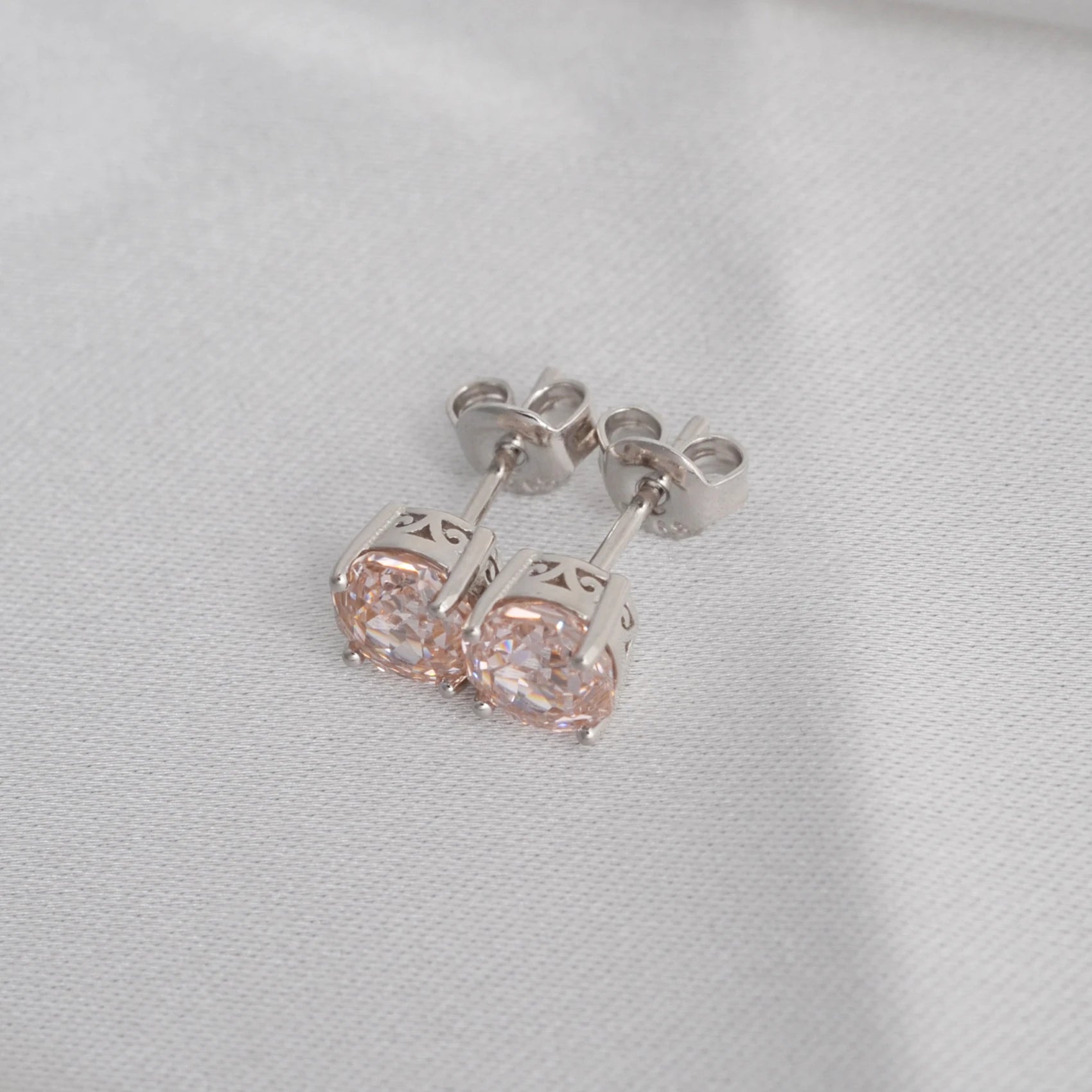 Delicate 1.5ct rose-cut octagon morganite pink stud earrings in white gold-plated sterling silver, sparkling with lab-created zircon accents.