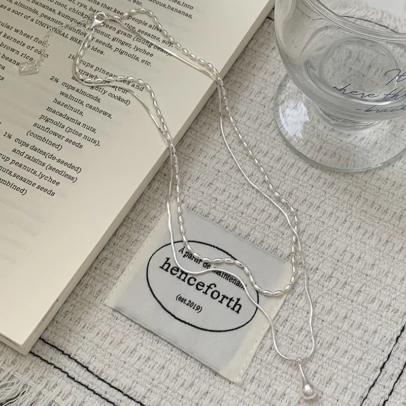 Elegant 925 sterling silver double layer necklace with a delicate, handmade pendant, perfect for everyday or special moments.