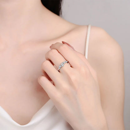 Elegant marquise-cut moissanite solitaire ring in sterling silver, showcasing a sparkling 6x3mm stone in a 4-prong setting.