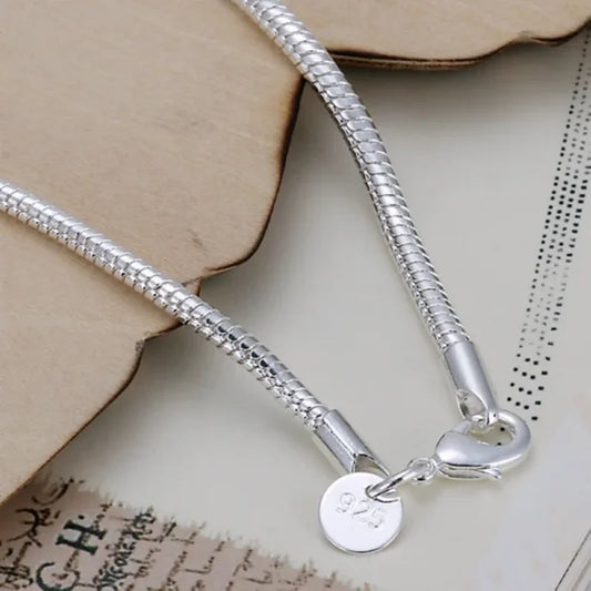 Delicate 925 sterling silver snake chain bracelet with a sleek, 3mm round link design and secure lobster clasp.