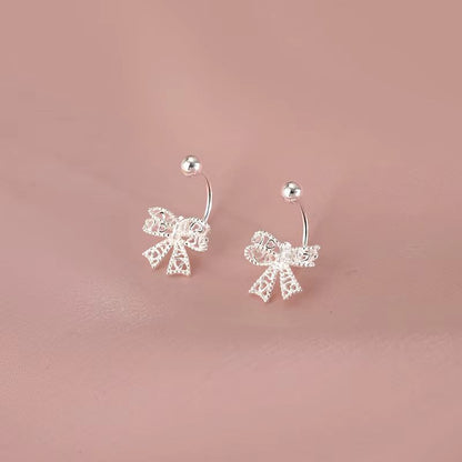 Delicate 925 sterling silver bowknot stud earrings with a charming, romantic design, perfect for any special occasion.