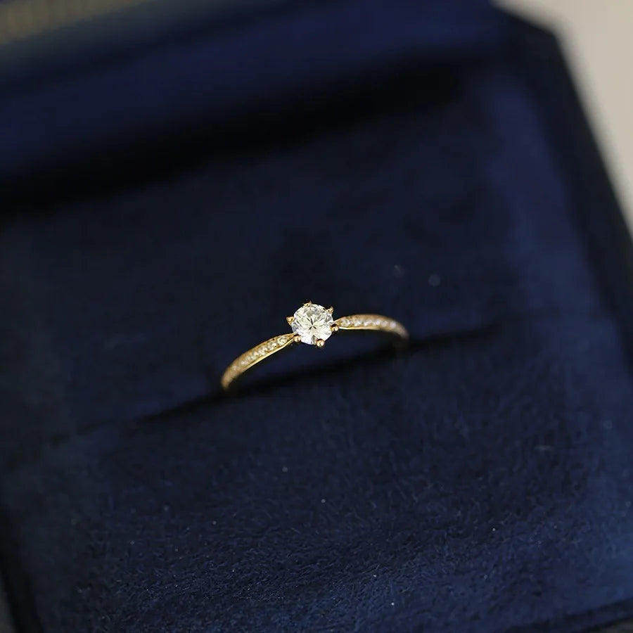 Elegant 925 sterling silver ring plated in 14K gold, featuring a sparkling 4mm zircon stone in a geometric 2mm band.