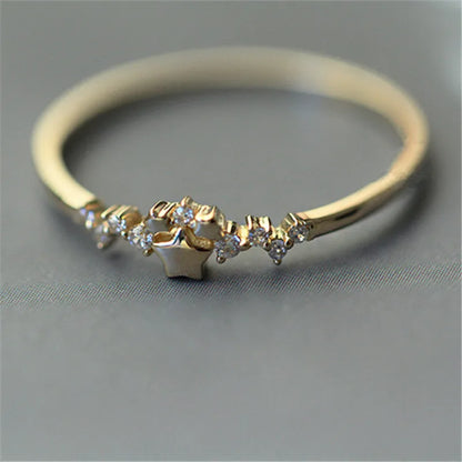 Delicate 925 sterling silver ring plated in 14K gold, featuring a sparkling zircon star design for a trendy, elegant look.