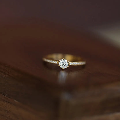 Elegant 925 sterling silver ring plated in 14K gold, featuring a sparkling 4mm zircon stone in a geometric 2mm band.
