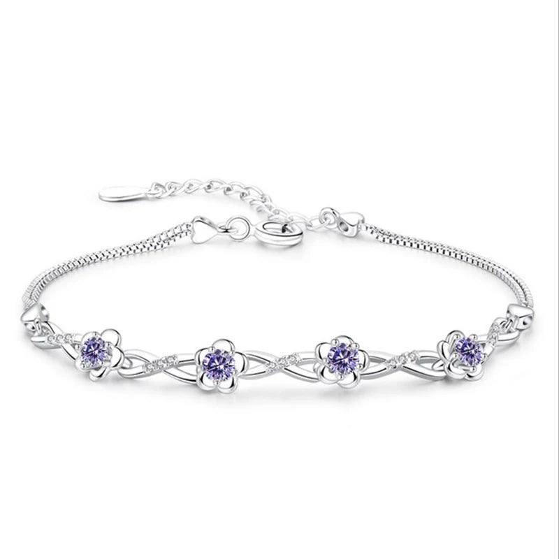 Delicate 925 sterling silver bracelet with a plant motif, sparkling cubic zirconia, and crystal accents for elegant wear.