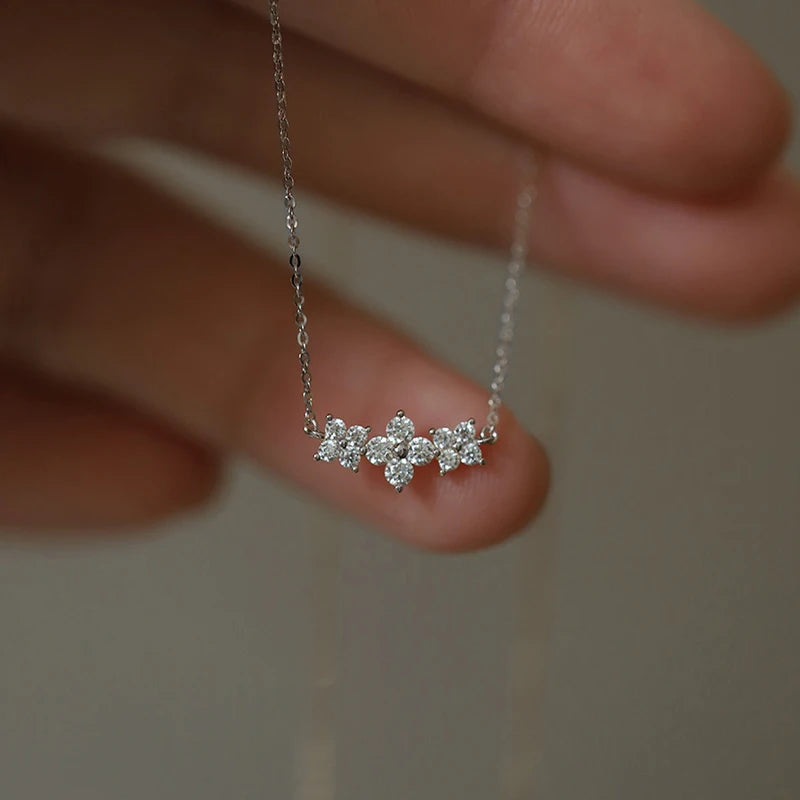 Delicate 925 sterling silver necklace with a sparkling moissanite four-leaf clover pendant, perfect for luck and love.