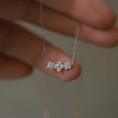 Delicate 925 sterling silver necklace with a sparkling moissanite four-leaf clover pendant, perfect for luck and love.