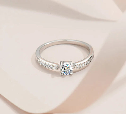 Stunning 925 Sterling Silver Bridal Ring Set featuring a sparkling 5mm round brilliant Moissanite in a classic 4-prong solitaire setting.