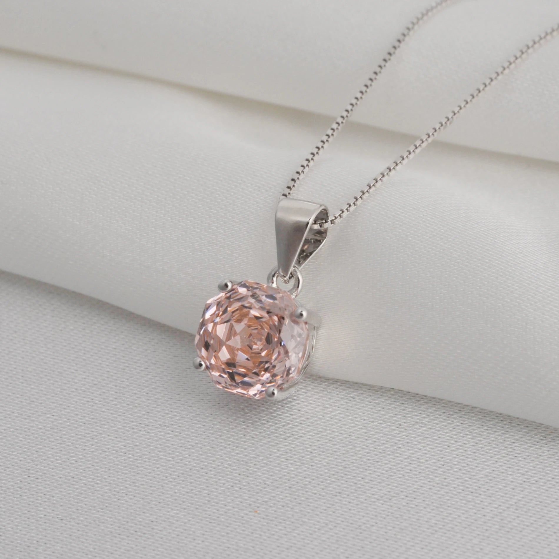 Stunning 2ct morganite pink octagon rose cut pendant necklace with an 8mm zircon, hanging on an 18-inch sterling silver rope chain.