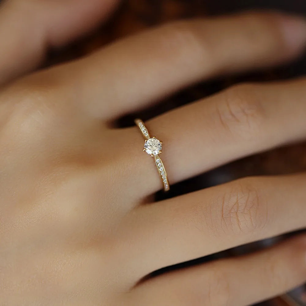 Gleaming 14K gold-plated sterling silver ring with a sparkling 4mm zircon stone in a geometric 2mm band design.