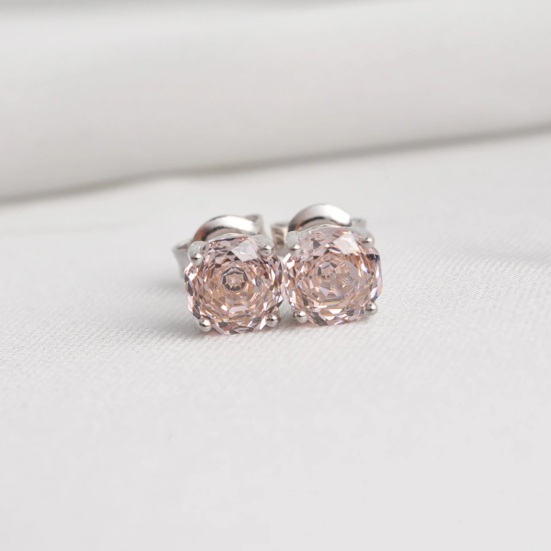 Delicate 1.5ct rose-cut octagon morganite pink stud earrings in white gold-plated sterling silver, sparkling with lab-created zircon accents.
