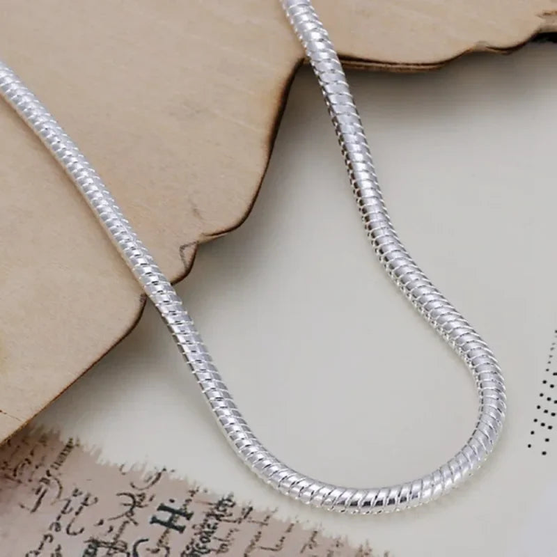 Gleaming 925 sterling silver snake chain bracelet with a sleek 3mm round link design and secure lobster clasp.