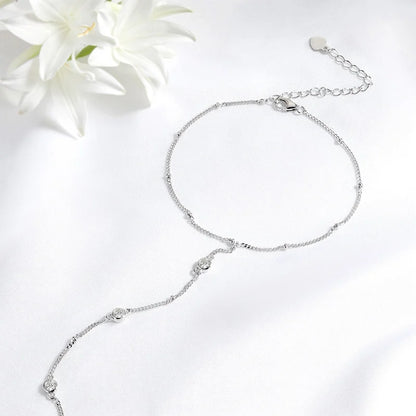 Gleaming 925 sterling silver bracelet with sparkling 18K-plated Moissanite stones in a timeless, unisex charm design.
