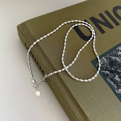 Elegant sterling silver necklace with a geometric zircon pendant sparkling on a delicate 40cm box chain.