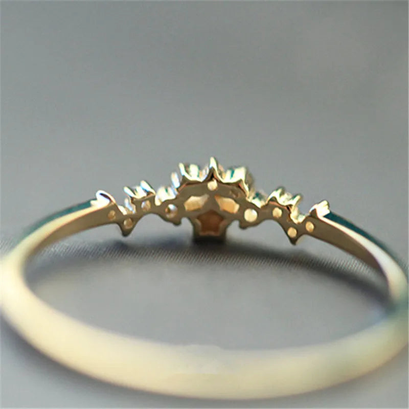 Delicate 925 sterling silver ring plated in 14K gold, featuring a sparkling zircon star design, perfect for women’s elegant style.
