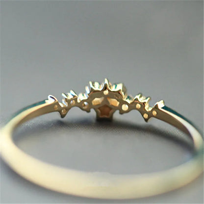 Delicate 925 sterling silver ring plated in 14K gold, featuring a sparkling zircon star design, perfect for women’s elegant style.