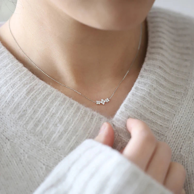 Delicate 925 sterling silver necklace featuring a sparkling moissanite four-leaf clover pendant for luck and elegance.