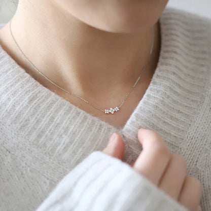 Delicate 925 sterling silver necklace featuring a sparkling moissanite four-leaf clover pendant for luck and elegance.