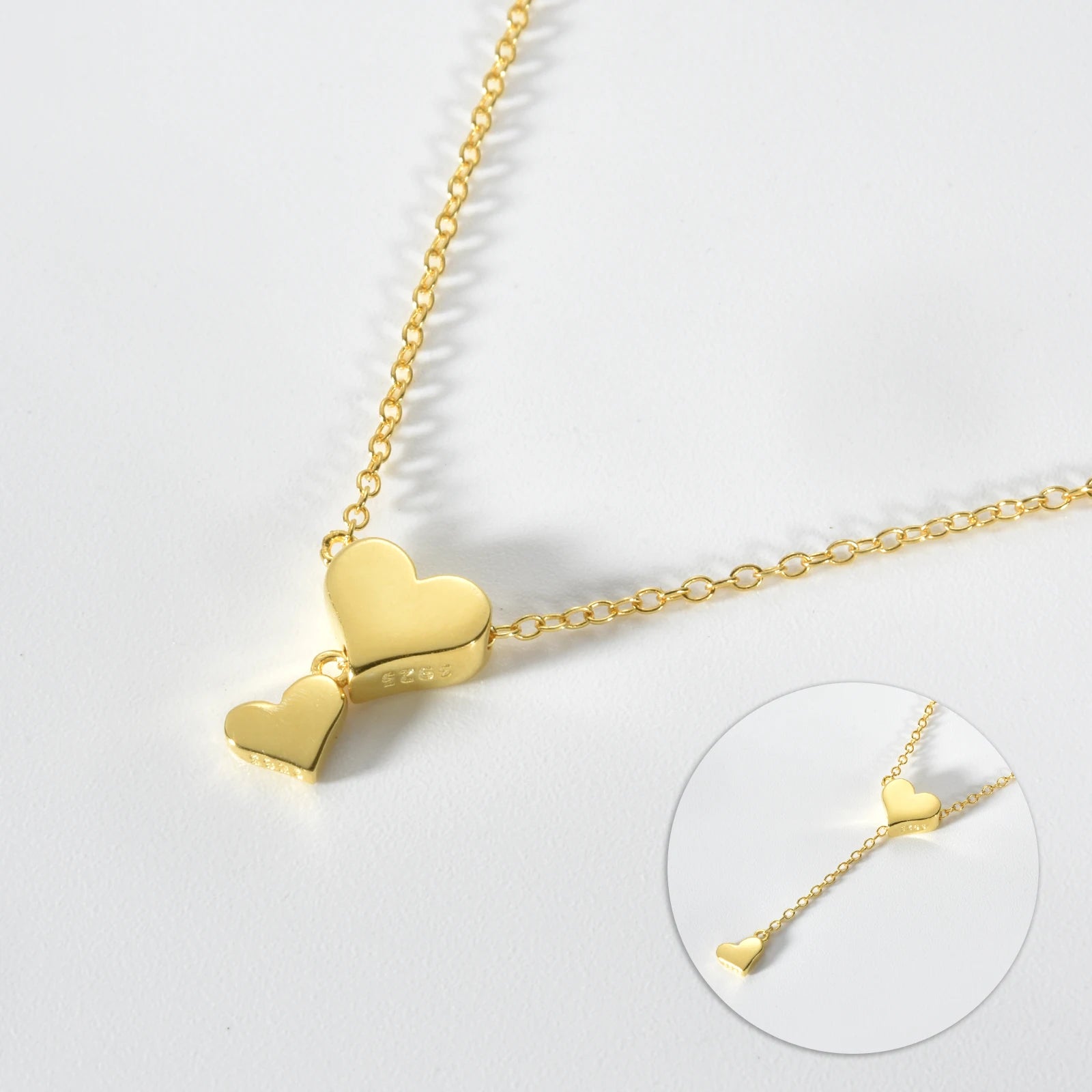 Delicate silver heart pendant necklace with a sparkling zircon center on a sleek 65cm gold-plated snake chain.