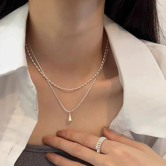Delicate 925 sterling silver double layer necklace with a handmade pendant, showcasing a timeless and elegant design.